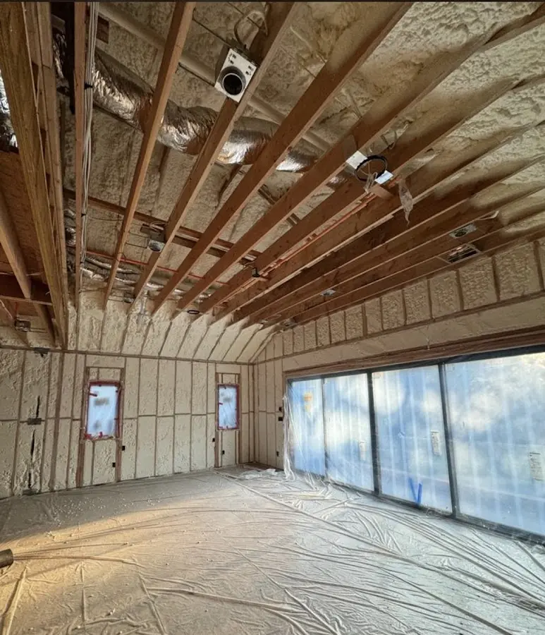 Interior walls and ceiling insulated with spray foam during new construction in Pepperell