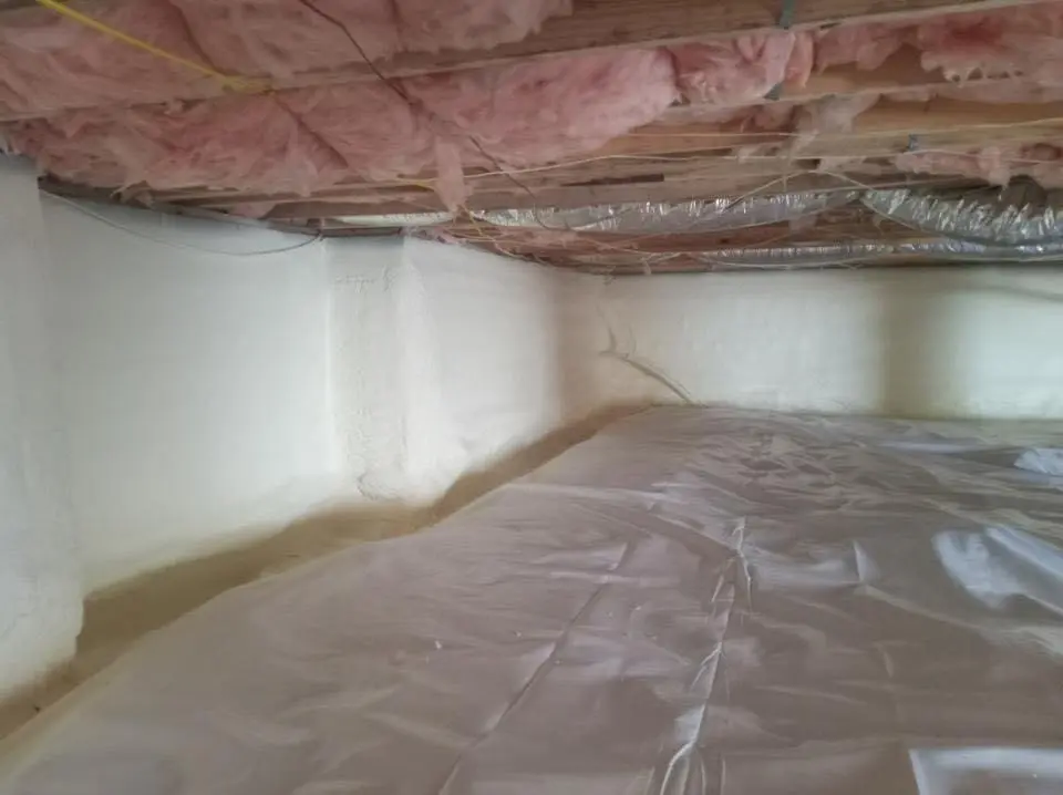 Crawl space encapsulation with closed-cell spray foam for Commercial Roof Restoration in Pepperell